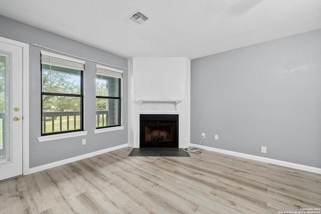 unfurnished living room with light hardwood / wood-style floors