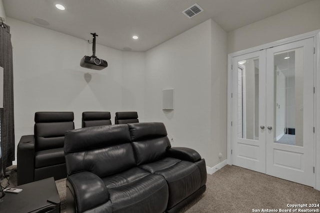 carpeted cinema with french doors