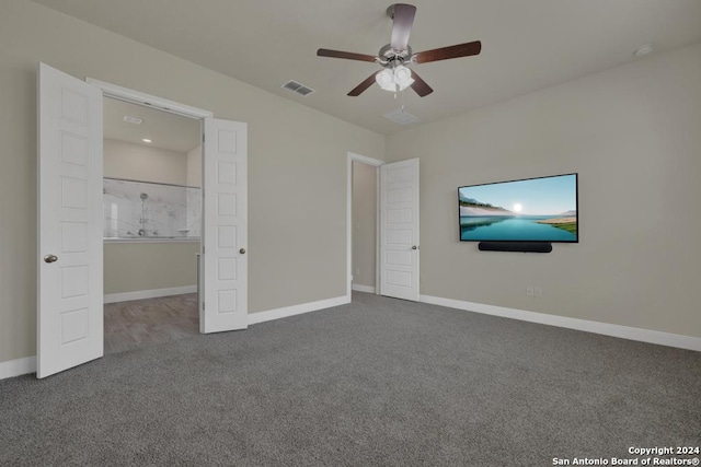 unfurnished bedroom featuring ceiling fan and carpet