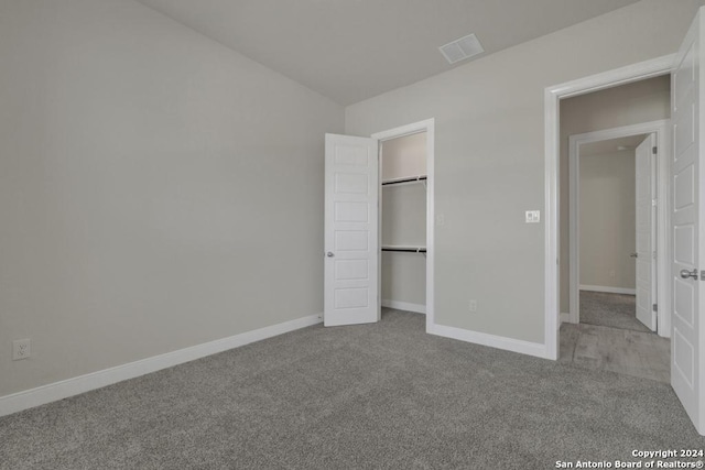 unfurnished bedroom featuring light colored carpet