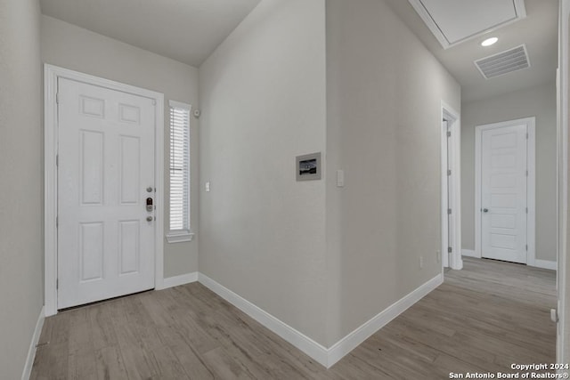 foyer entrance with light wood-type flooring