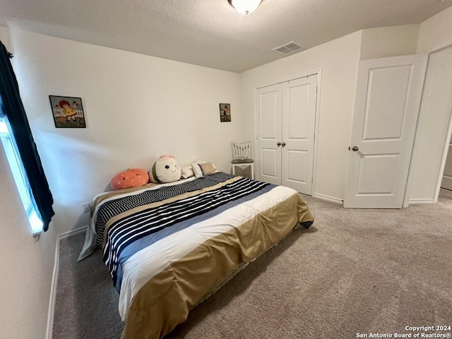 carpeted bedroom featuring a closet