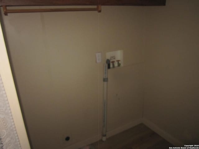 laundry area featuring hookup for a washing machine, baseboards, and laundry area