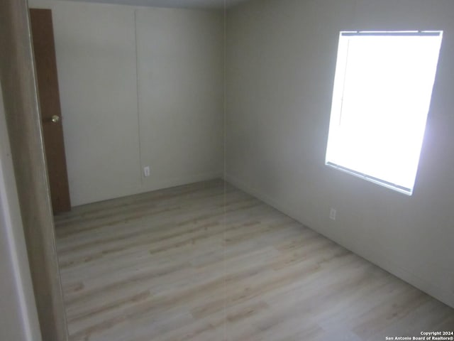 empty room with light wood-type flooring