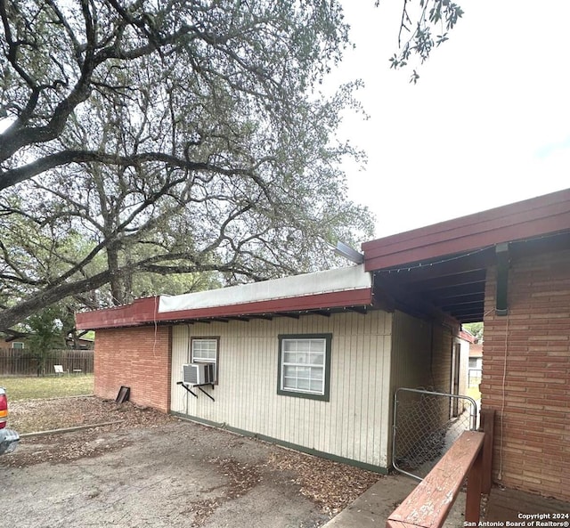 view of home's exterior with cooling unit