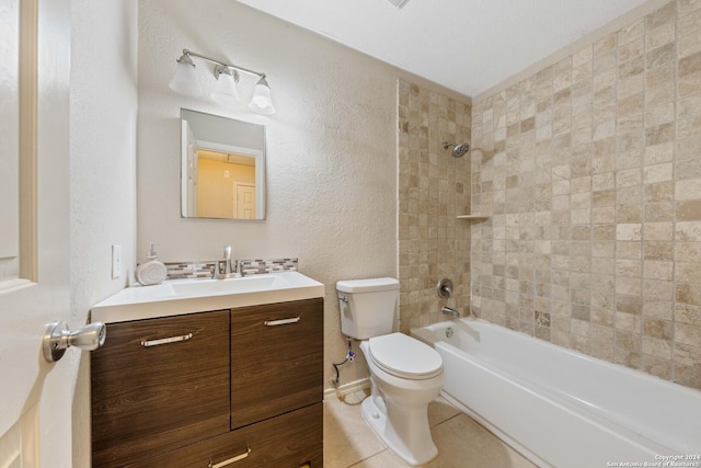 full bathroom with tiled shower / bath combo, vanity, toilet, and tile patterned flooring