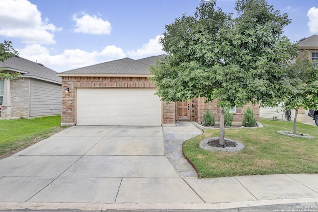 view of front of home featuring a garage and a front lawn