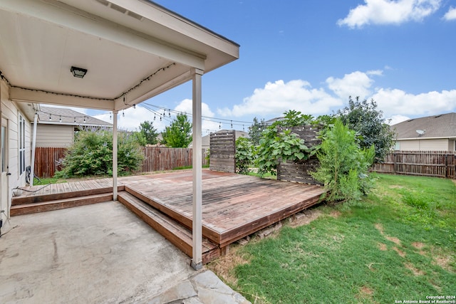 wooden deck with a lawn