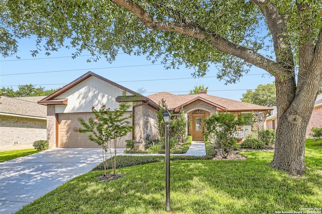 ranch-style home featuring driveway, brick siding, and a front yard