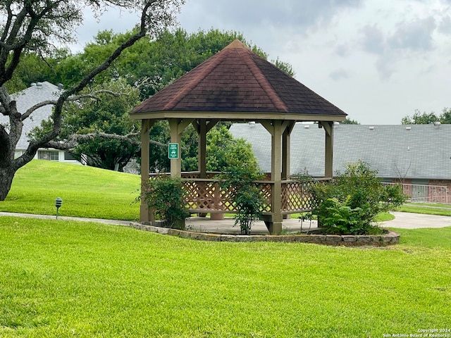 view of property's community featuring a gazebo and a lawn