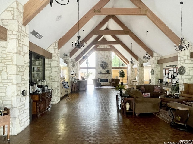 living area featuring decorative columns, a fireplace, high vaulted ceiling, and beamed ceiling