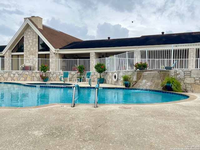 view of swimming pool with a patio