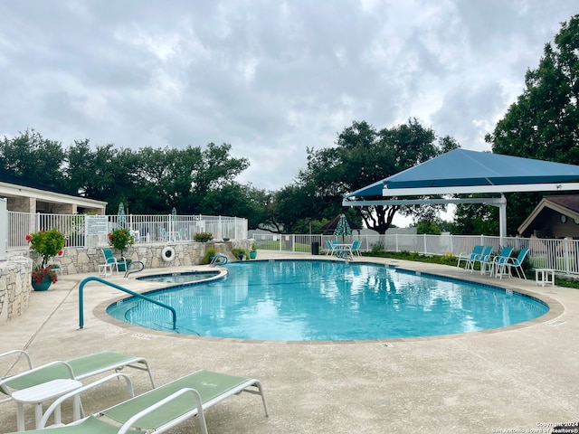 view of swimming pool with a patio area