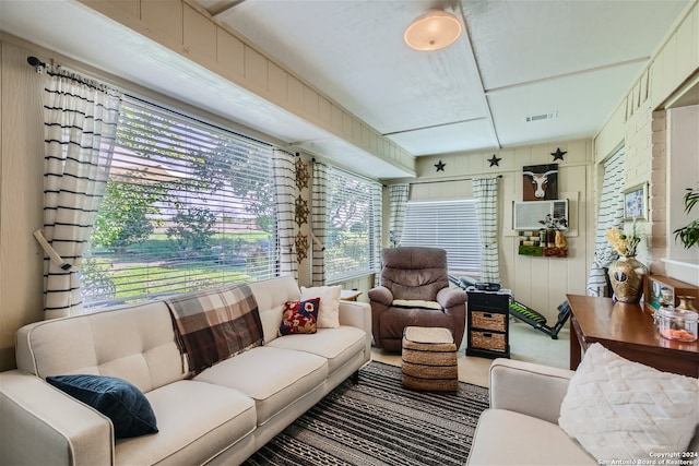 living room with visible vents and a healthy amount of sunlight