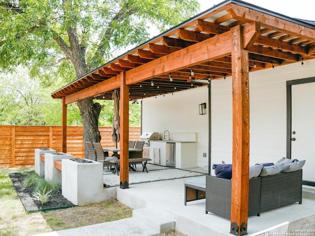 view of patio / terrace featuring an outdoor kitchen and an outdoor living space