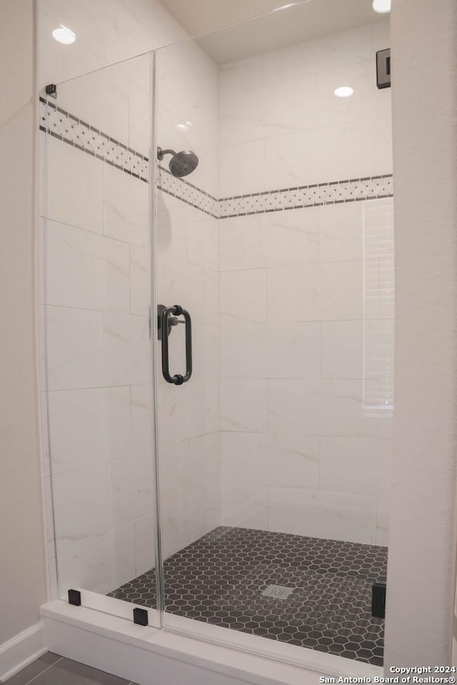 bathroom featuring an enclosed shower