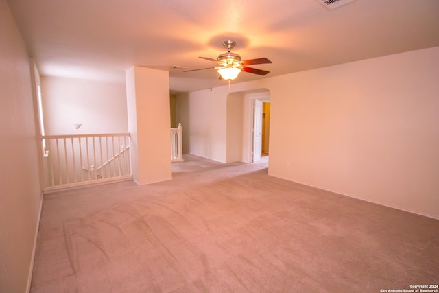 carpeted empty room with ceiling fan