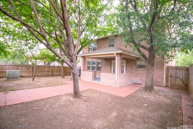 back of property featuring a patio area