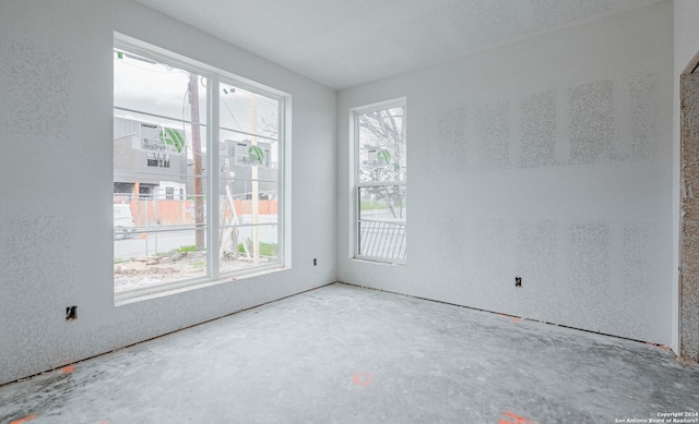 spare room featuring concrete floors