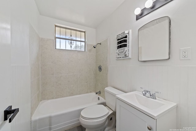 full bathroom featuring vanity, toilet, and tiled shower / bath