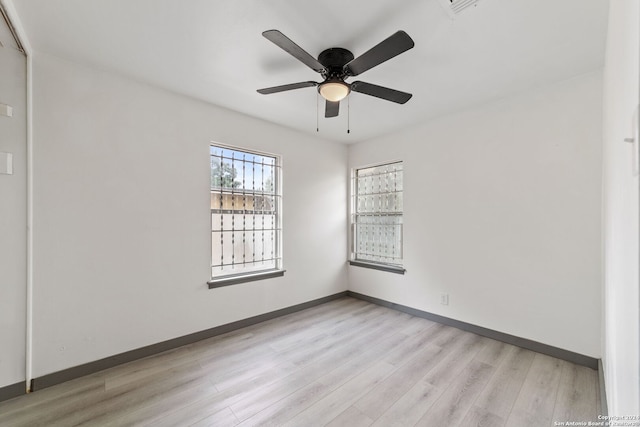 empty room featuring light wood-type flooring and ceiling fan