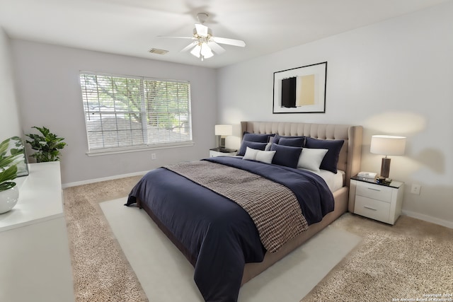 bedroom with light carpet and ceiling fan