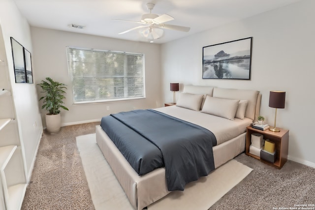 bedroom with light carpet and ceiling fan