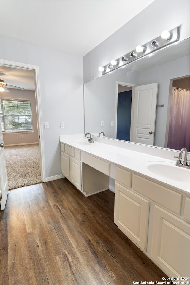 bathroom featuring vanity, wood-type flooring, and ceiling fan