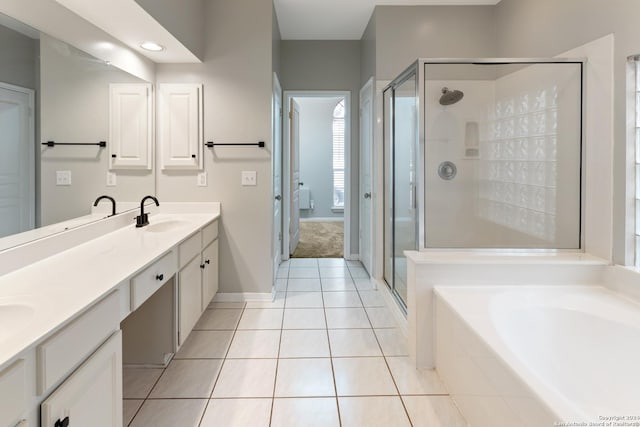 bathroom with independent shower and bath, vanity, and tile patterned floors