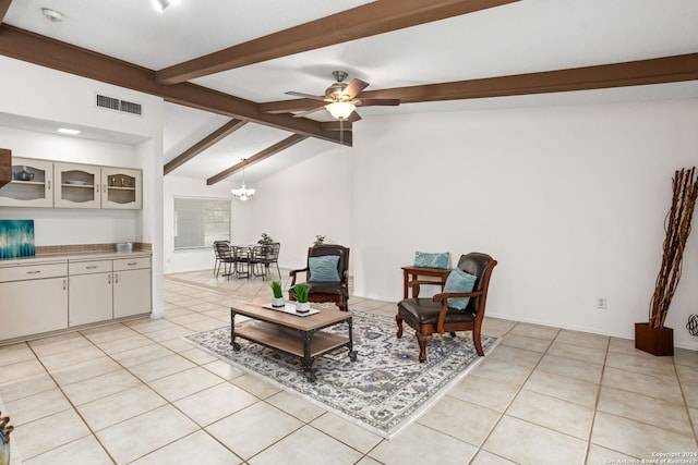 sitting room with ceiling fan with notable chandelier, lofted ceiling with beams, and light tile patterned flooring