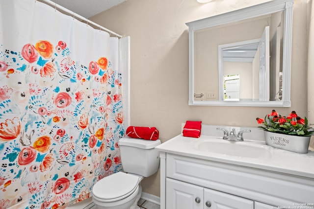 bathroom featuring vanity, curtained shower, and toilet