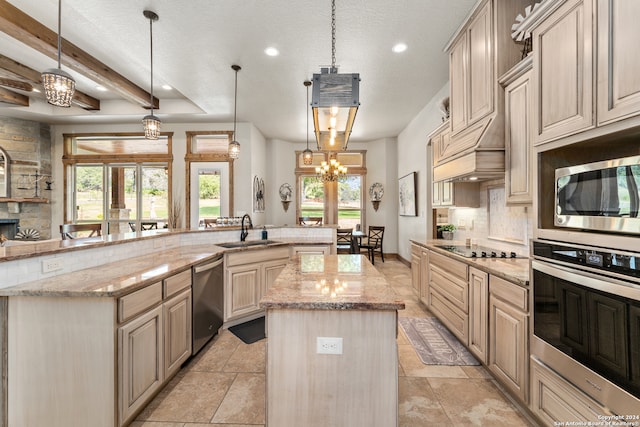 kitchen featuring beam ceiling, stainless steel appliances, light stone countertops, decorative light fixtures, and a large island with sink