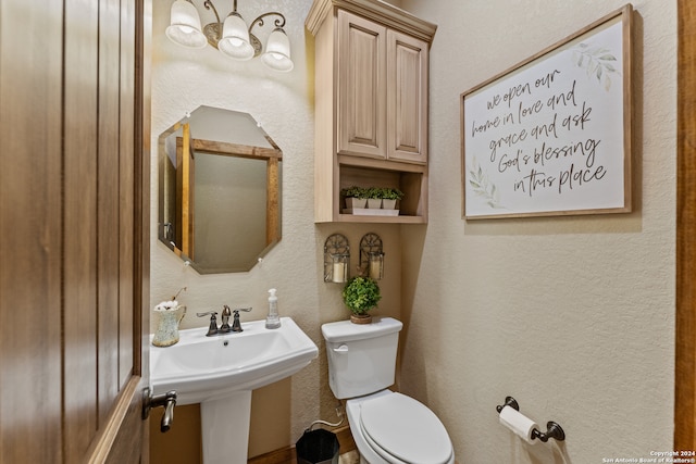 bathroom featuring sink and toilet