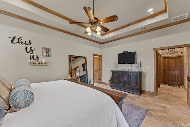 bedroom featuring ornamental molding, light tile patterned floors, ceiling fan, and a tray ceiling