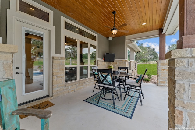 view of patio featuring ceiling fan