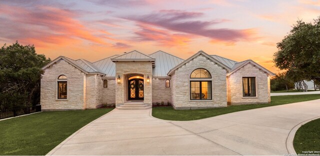 view of front of property with a yard