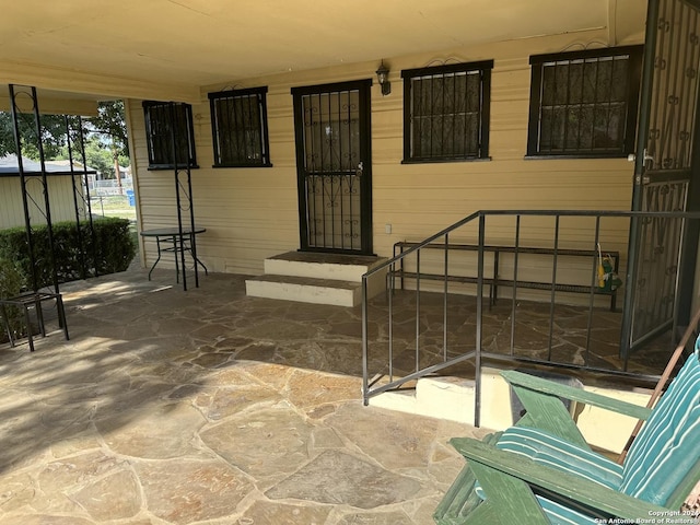 doorway to property with a patio area