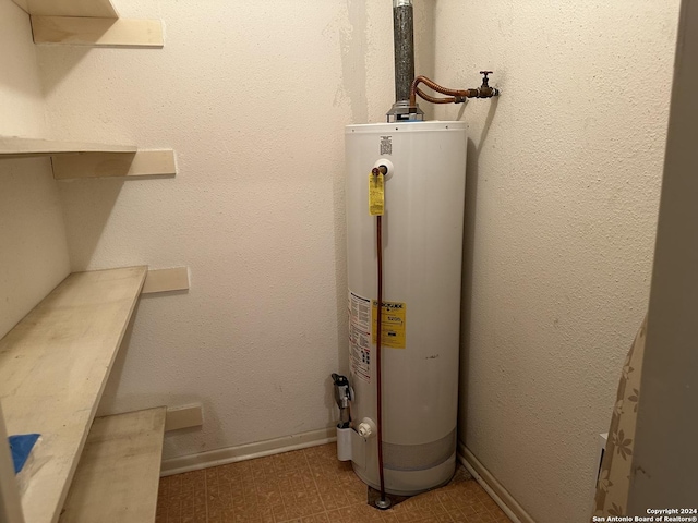 utility room with gas water heater