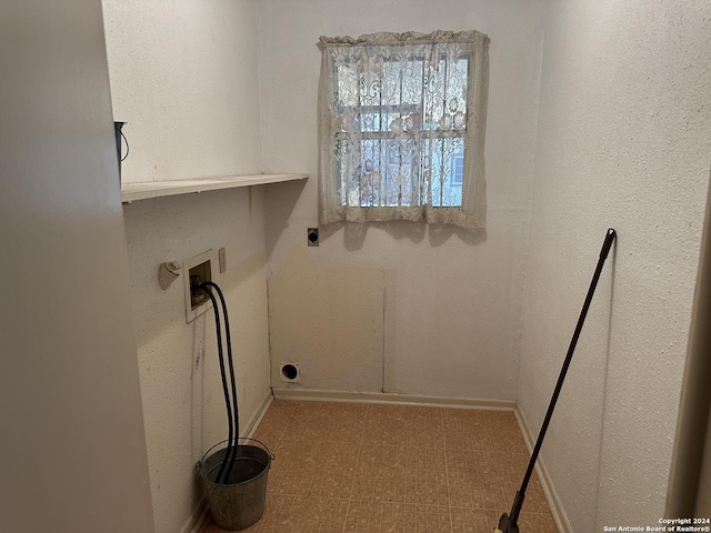 laundry area featuring electric dryer hookup and washer hookup