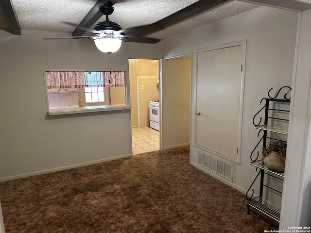 interior space with light carpet, a textured ceiling, and ceiling fan