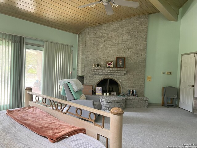 carpeted living room with wood ceiling, ceiling fan, lofted ceiling, and a fireplace