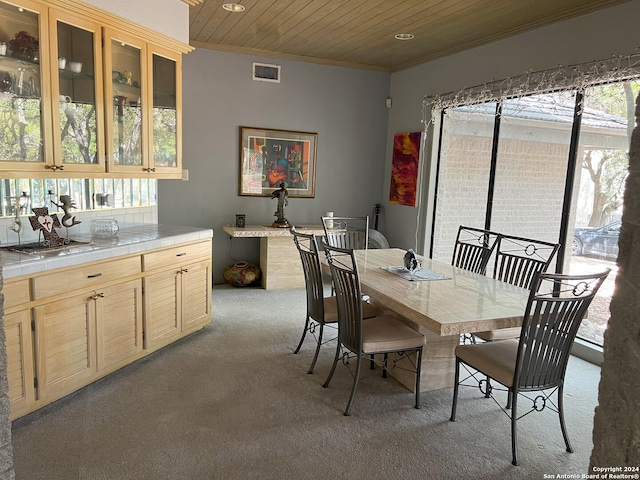 dining space with wooden ceiling, carpet, visible vents, and ornamental molding