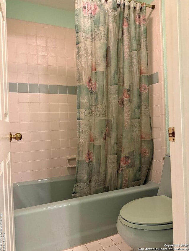 bathroom with toilet, shower / bath combo with shower curtain, and tile patterned floors