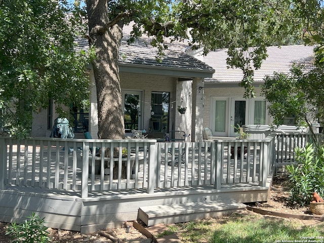 rear view of property with a deck