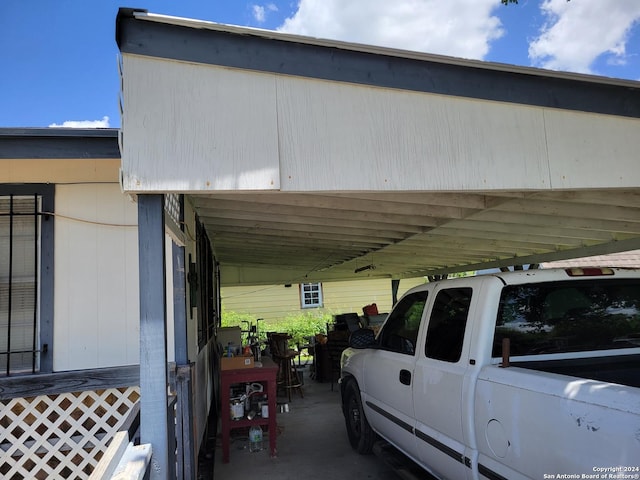 view of vehicle parking with a carport