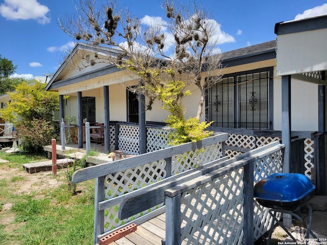 exterior space featuring a porch and area for grilling