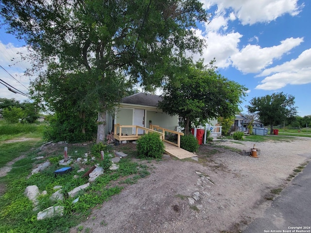 obstructed view of property featuring a wooden deck