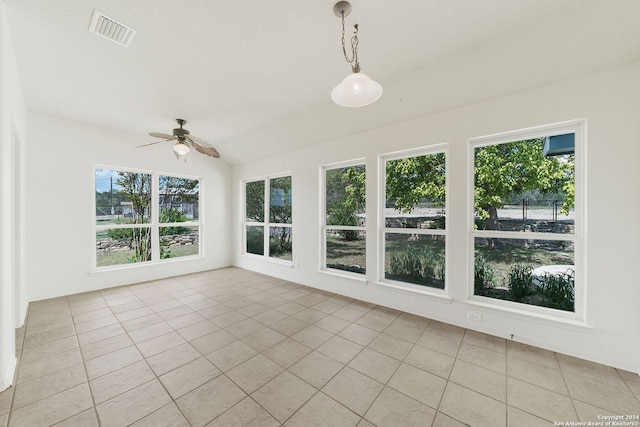 unfurnished sunroom featuring ceiling fan and lofted ceiling