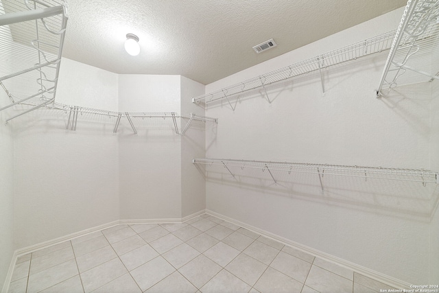 walk in closet featuring tile patterned floors