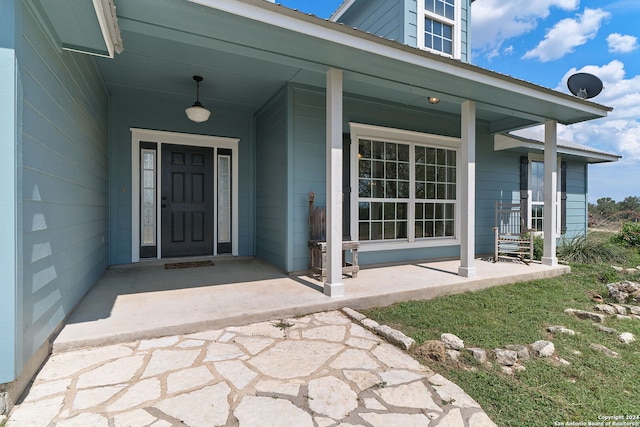 entrance to property with a porch